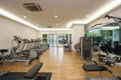 a gym with several treadmills and exercise machines at Luxury Balcony Suites- Homestay in Kuala Lumpur