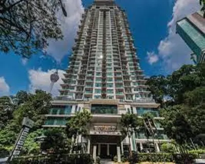 a large building with a tall tower in the sky at Luxury Balcony Suites- Homestay in Kuala Lumpur