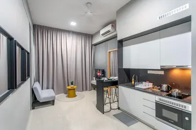 a kitchen with a sink and a counter top at The Colony & Luxe Kuala Lumpur with Skypool by Cobnb in Kuala Lumpur