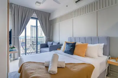 a large bedroom with a large bed and a balcony at The Colony & Luxe Kuala Lumpur with Skypool by Cobnb in Kuala Lumpur