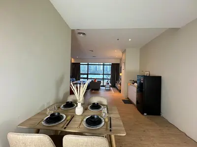 a dining room table and chairs in a room at The Benton - Bangsar Trade Centre in Kuala Lumpur