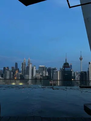 a view of a city skyline from the roof of a building at Stay at Regalia KLCC View Sky Pool in Kuala Lumpur