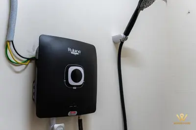 a phone hooked up to a wall with a microphone at Gather & Stay 5BR Cozy Home near Setapak & Wangsa Maju in Kuala Lumpur
