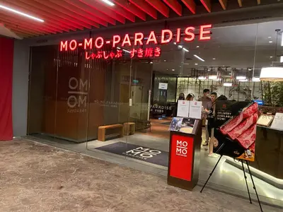 a store front with a nomo parakeet sign in a building at Arcoris Mont Kiara FaceHome in Kuala Lumpur