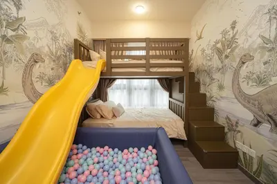 a kids room with a slide and a bunk bed at Agile Bukit Bintang in Kuala Lumpur