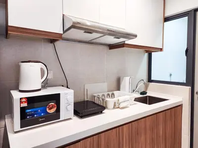 a kitchen with a microwave and a sink at Flora Residency KL -- Botanical Vibes #3BR2B #1-7 pax by Cowidea in Kuala Lumpur