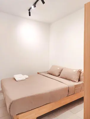 a bed in a room with a white wall at Flora Residency KL -- Botanical Vibes #3BR2B #1-7 pax by Cowidea in Kuala Lumpur