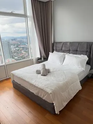 a bedroom with a large bed with a large window at URBAN SKY HOME NEAR KLCC Complementary Breakfast in Kuala Lumpur