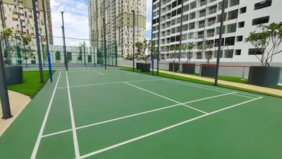 a tennis court in a city with tall buildings at LSH33 Residence Sentul KL by HomeBrickz in Kuala Lumpur