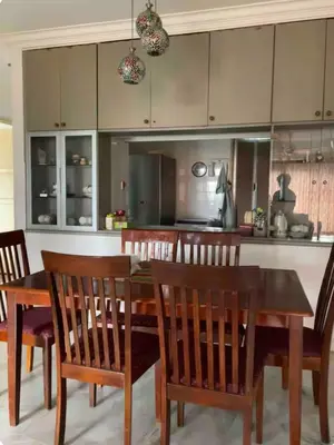 a kitchen with a wooden dining room table and chairs at Condo in kuala lumpur in Kuala Lumpur