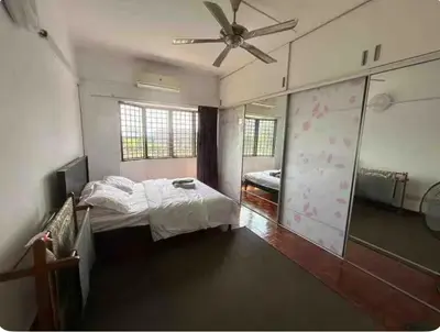 a bedroom with a bed and a ceiling fan at Condo in kuala lumpur in Kuala Lumpur