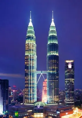 a group of tall buildings in a city at night at SS Grey inn Bukit Bintang in Kuala Lumpur