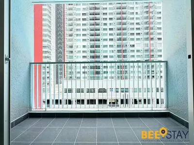 a balcony with a view of a tall building at Salak Selatan Pool View with Wifi & Netflix 4PAX in Kuala Lumpur