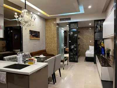 a kitchen and living room with a dining room at Dorsett Residence Service Suites at Kuala Lumpur in Kuala Lumpur