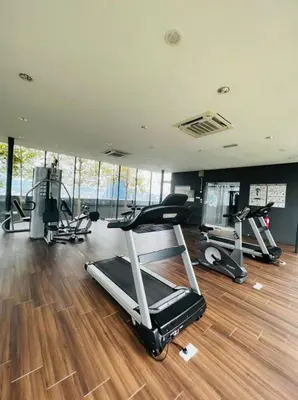 a gym with several treadmills and exercise machines at Dorsett Residence Service Suites at Kuala Lumpur in Kuala Lumpur