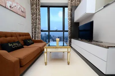 a living room with a couch and a table at Dorsett Residence Service Suites at Kuala Lumpur in Kuala Lumpur