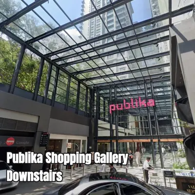 a shopping gallery with a car parked in front of a building at Publika Mont Kiara City View Suite - 8KM to KLCC in Kuala Lumpur