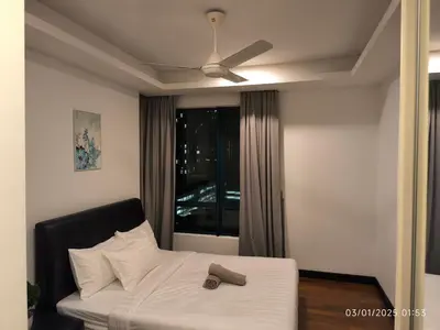 a bedroom with a bed with a hat on it at 0111 Sweet Home-Casa Residency 2R 2B City View in Kuala Lumpur