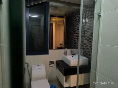 a bathroom with a sink and a toilet and a mirror at 0111 Sweet Home-Casa Residency 2R 2B City View in Kuala Lumpur