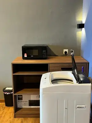 a microwave sitting on top of a counter with a toaster at Mid Valley & The Sphere BTC in Kuala Lumpur