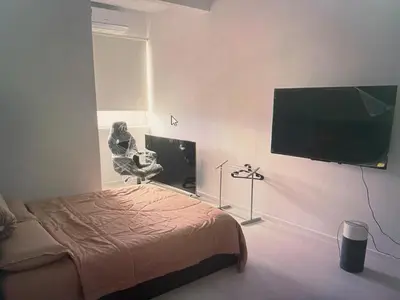 a bedroom with a bed and a flat screen tv at Pixel City Sentral Studio Walk to Lrt1Min KLCC in Kuala Lumpur
