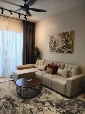 a living room with a couch and a ceiling fan at Vista Sentul WIFI AnDroidTV 8KM to KLCC in Kuala Lumpur