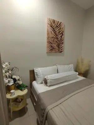 a bedroom with a bed and a painting on the wall at Vista Sentul WIFI AnDroidTV 8KM to KLCC in Kuala Lumpur