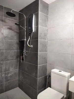 a bathroom with a shower with a toilet and a phone at Vista Sentul WIFI AnDroidTV 8KM to KLCC in Kuala Lumpur