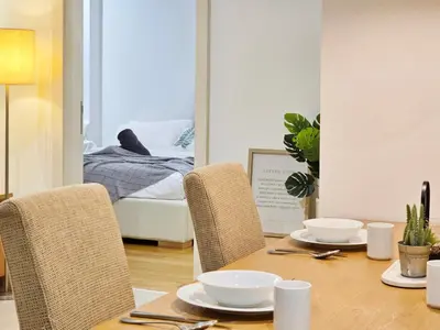 a dining room with a table with chairs and a bed at Kuala Lumpur Bintang Fairlane #157 TRX in Kuala Lumpur