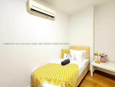 a bedroom with a bed and a air conditioner at Bukit Bintang Fairlane Residence #18 Kuala Lumpur in Kuala Lumpur