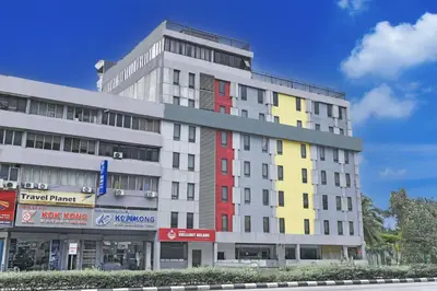 a tall white building with red yellow and gray at Palette KL Sentral near Pudu LRT formerly RPC Blissful Homes in Kuala Lumpur