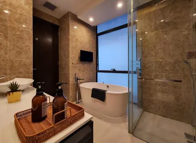 a bathroom with a shower and a toilet and a sink at Dorsett Residence Kuala Lumpur #08 TRX KLCC Pavilion in Kuala Lumpur