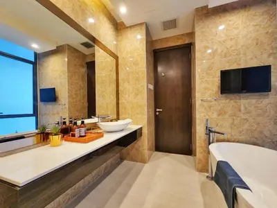 a bathroom with a tub and a sink and a bath tub at Dorsett Residence Kuala Lumpur #08 TRX KLCC Pavilion in Kuala Lumpur