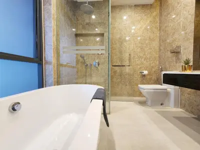 a bathroom with a tub and a shower and a toilet at Dorsett Residence Kuala Lumpur #08 TRX KLCC Pavilion in Kuala Lumpur