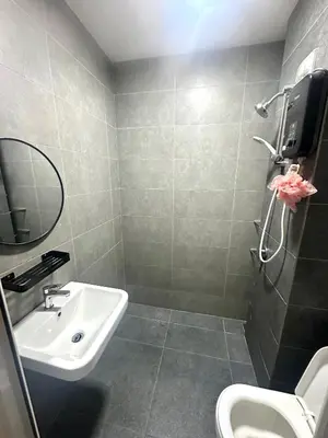 a bathroom with a sink and a toilet at Neu Suites Studio Home Stay in Kuala Lumpur