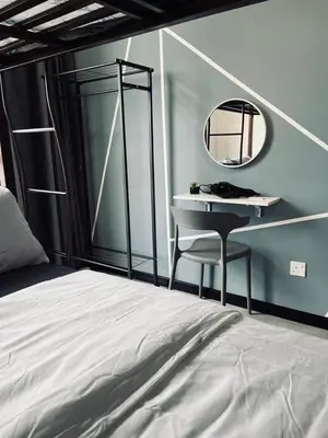 a bedroom with a bed and a mirror and a desk at Neu Suites 2 Bedroom Family Suites in Kuala Lumpur