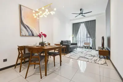 a dining room and living room with a table and chairs at Atelier 118 Chinatown in Kuala Lumpur