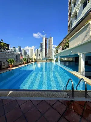 a large swimming pool on top of a building at Holiday Place by Luvit Stay in Kuala Lumpur