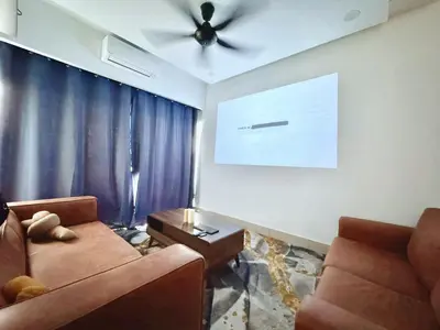 a living room with a couch and a ceiling fan at NEW Minimalist Cozy 3R3B SgBesi - 6 pax in Kuala Lumpur