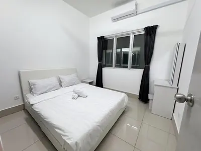 a white bed in a room with a window at NEW Minimalist Cozy 3R3B SgBesi - 6 pax in Kuala Lumpur