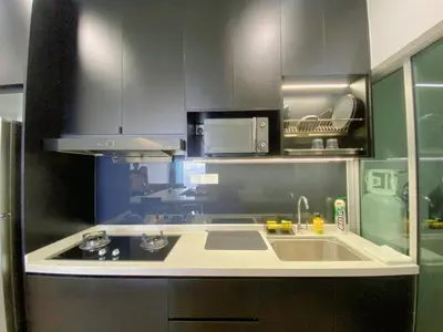 a kitchen with a sink and a microwave at NEW Minimalist Cozy 3R3B SgBesi - 6 pax in Kuala Lumpur