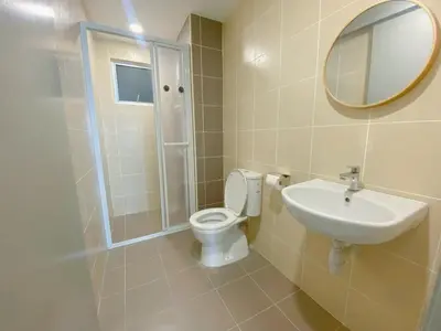 a bathroom with a toilet and a sink and a mirror at NEW Minimalist Cozy 3R3B SgBesi - 6 pax in Kuala Lumpur