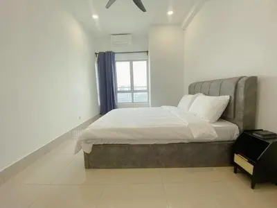 a bedroom with a large bed with a window at NEW Minimalist Cozy 3R3B SgBesi - 6 pax in Kuala Lumpur