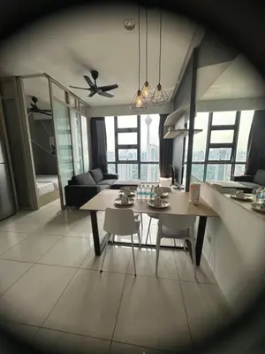a kitchen and living room with a table and chairs at The Robertson Residence Kuala Lumpur by Alan in Kuala Lumpur