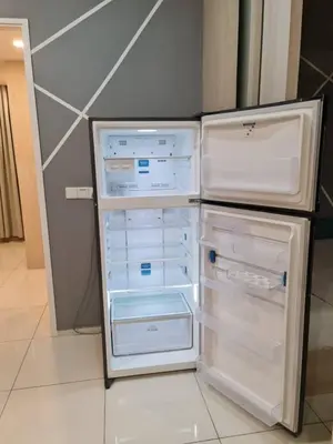 an empty refrigerator with its door open in a kitchen at The Robertson Residence Kuala Lumpur by Alan in Kuala Lumpur