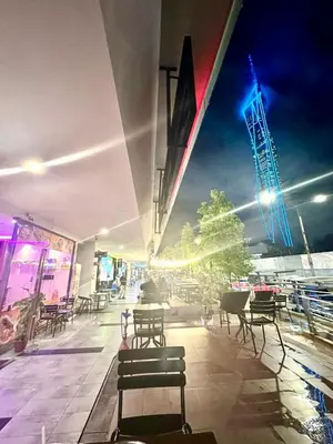 a group of chairs and tables on a patio at The Robertson Residence Kuala Lumpur by Alan in Kuala Lumpur