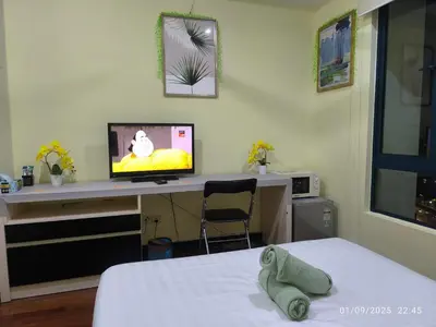a room with a desk with a tv and a bed at 0267 Sweet Home-Casa Residency 1R 1B in Kuala Lumpur