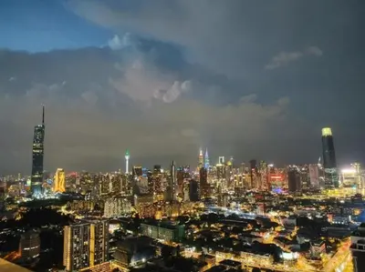 a view of a large city at night at Trion KL, Jalan Chan Sow Lin, Kuala Lumpur by One Guesthouse in Kuala Lumpur