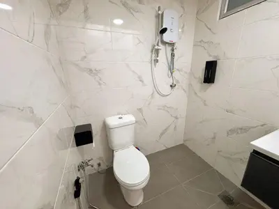 a white bathroom with a toilet and a shower at Private Pool SemiD 5 Min Walk SunwayVelocity Max 21 Pax in Kuala Lumpur