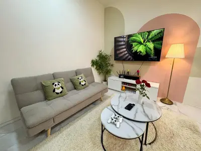 a living room with a couch and a table at Private Pool SemiD 5 Min Walk SunwayVelocity Max 21 Pax in Kuala Lumpur